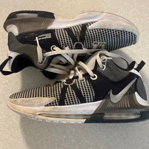 Size 10 LeBron Witness 7 white and black sneakers.